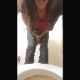A girl bends over a toilet and takes an explosive, runny shit, making a total mess of the toilet in the process. 720P vertical HD format video. About 3 minutes.